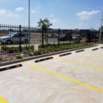 Empty car park with clear yellow lines and barriers