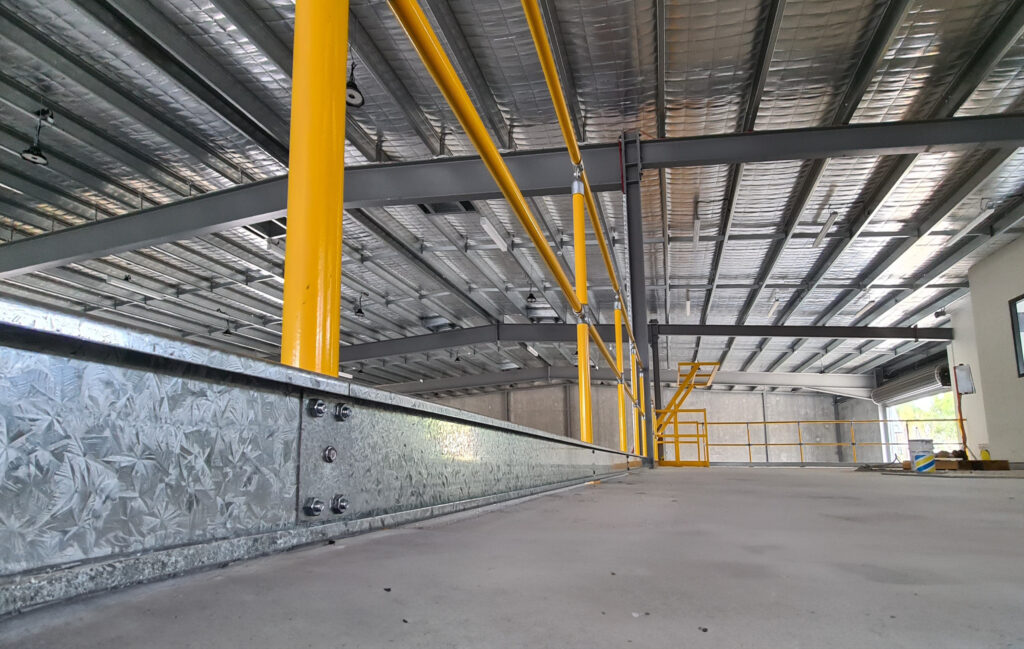 Interior view of a spacious industrial building.