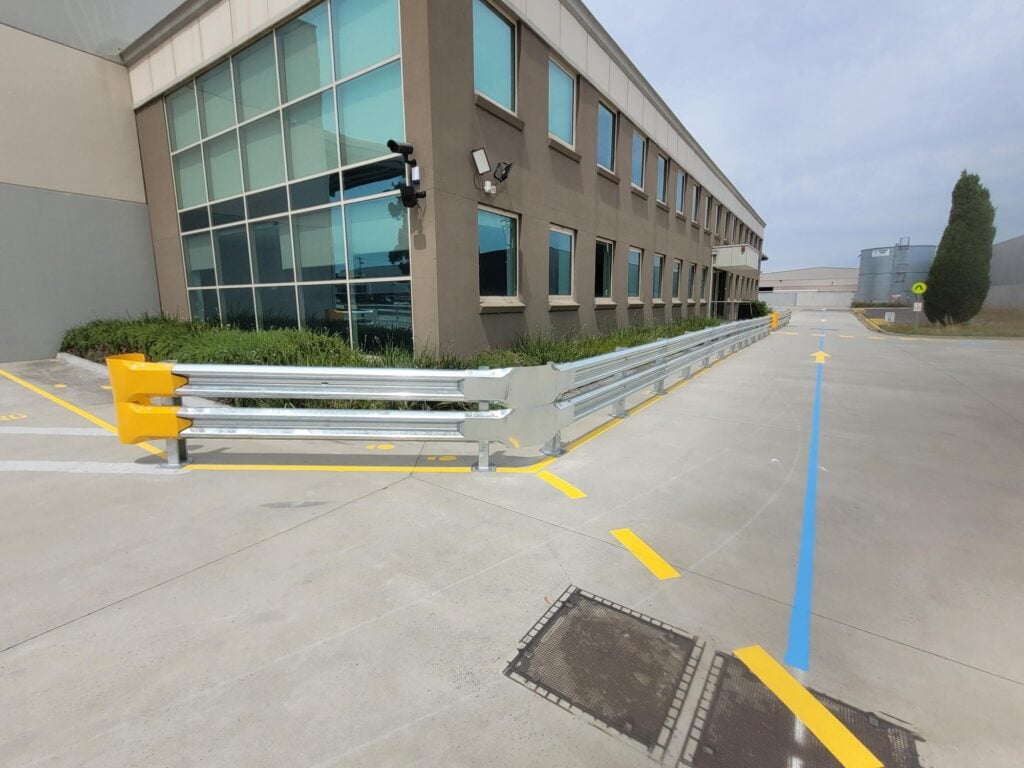 Industrial site with safety barriers and marked pathways