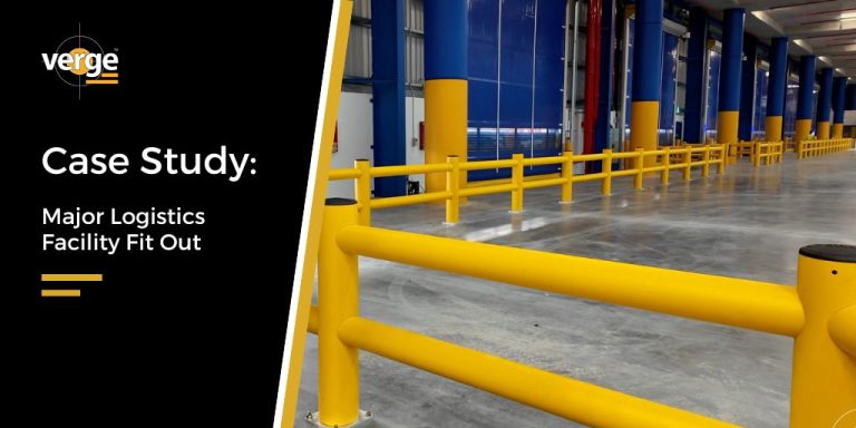 Interior of a logistics facility with yellow barriers.