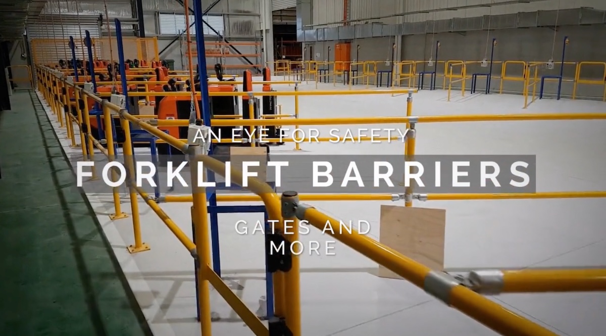 Warehouse with forklift barriers for safety measures.