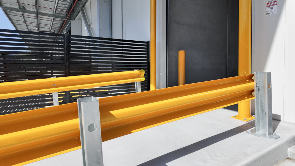Yellow safety barriers in industrial setting