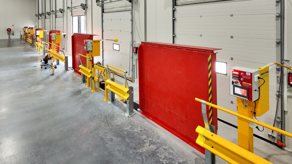 Industrial loading dock with safety barriers and controls