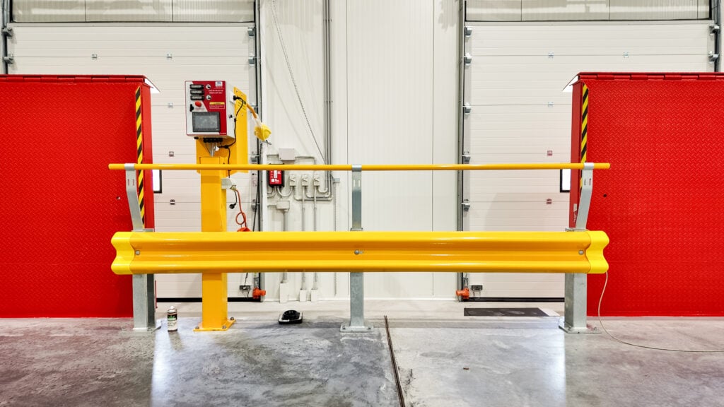Yellow safety barrier in industrial environment