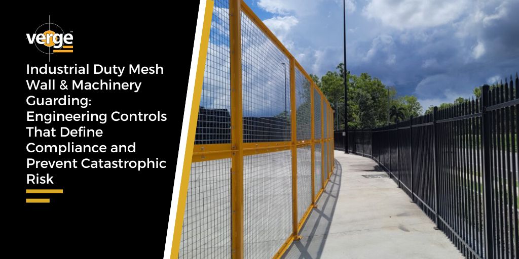 Industrial yellow mesh fencing along concrete pathway
