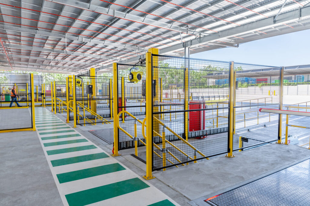 Industrial warehouse with safety fencing and walkways