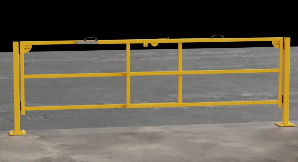 Yellow steel safety barrier gate on a concrete floor