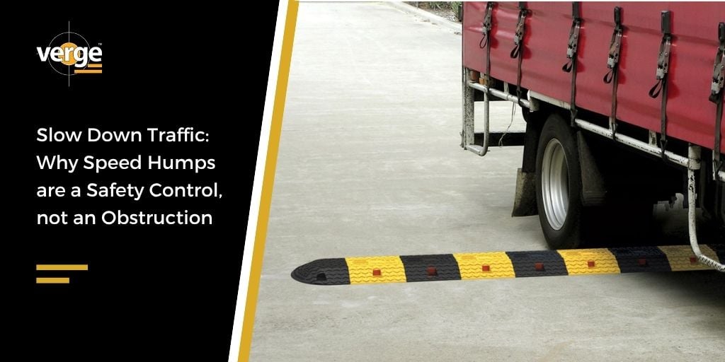 Truck approaching black and yellow speed hump