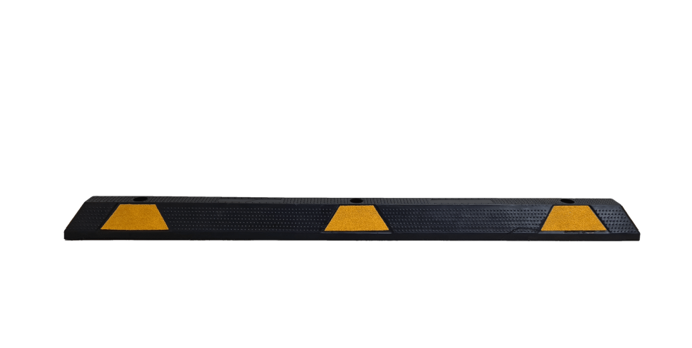 Black rubber speed bump with yellow markers.