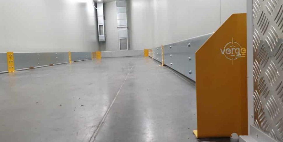 Industrial cool room featuring Verge Wall Pro barriers installed along the walls, providing impact protection with yellow end brackets and steel panels.